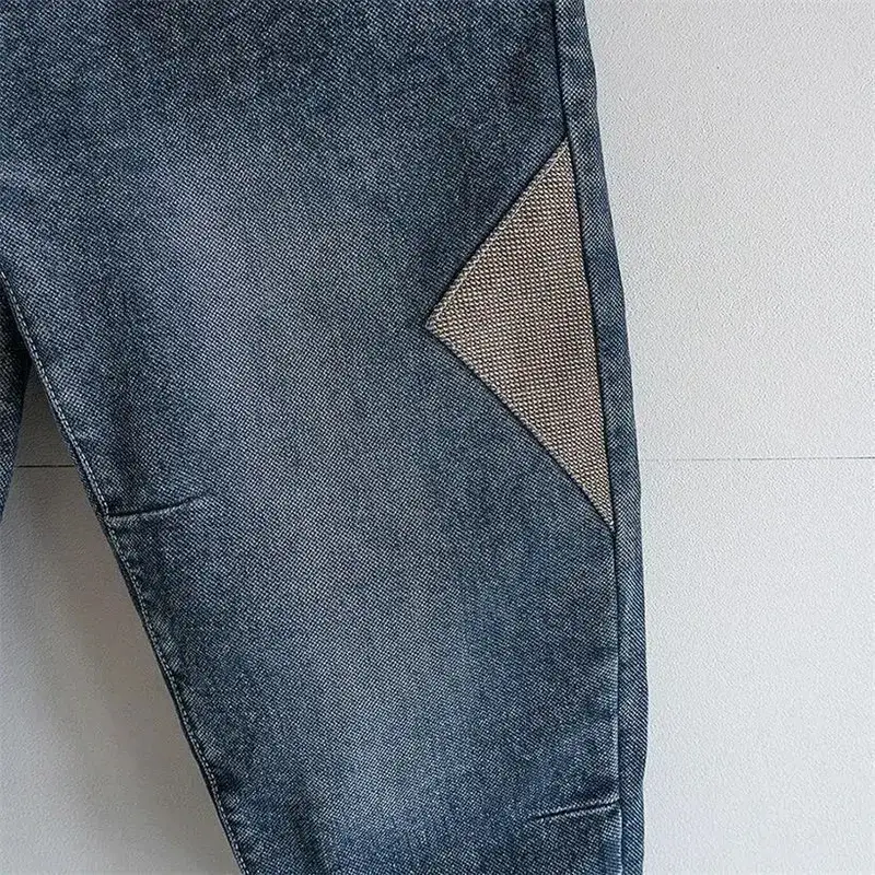 Solto cintura elástica denim jeans primavera outono emendado harem calças casuais masculinas 2024 coreano novo estiramento baggy carga jeans