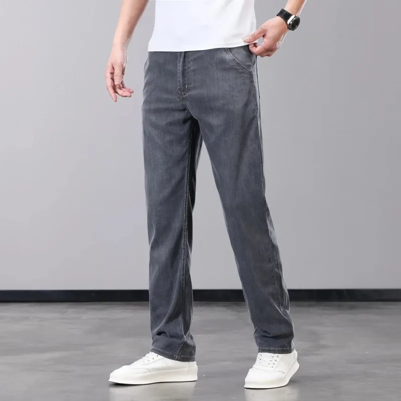 Verão fino jeans masculino lyocell tecido macio respirável calças jeans retas marca homem elástico de seda gelo calças casuais cinza azul
