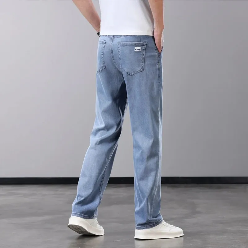 Verão fino jeans masculino lyocell tecido macio respirável calças jeans retas marca homem elástico de seda gelo calças casuais cinza azul