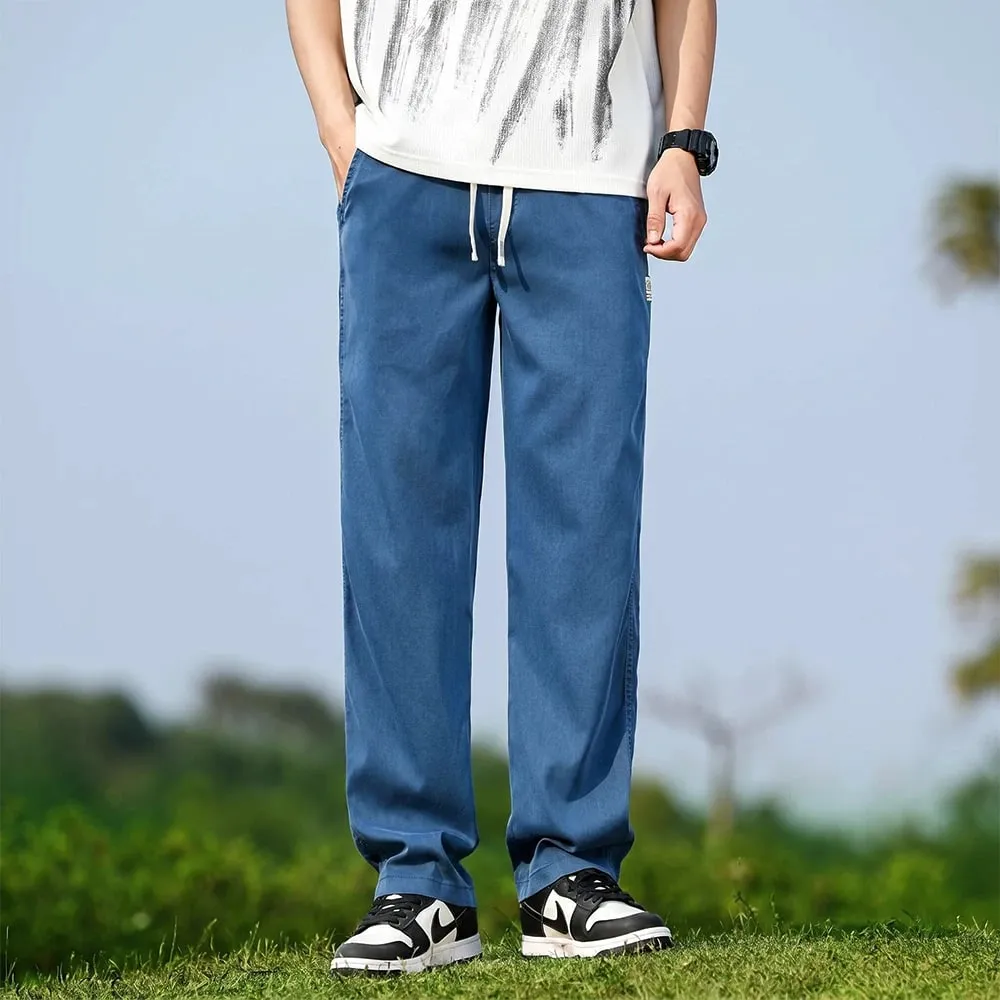 Verão masculino macio lyocell tecido jeans fino solto calças jeans retas cordão cintura elástica calças casuais plus size M-5XL