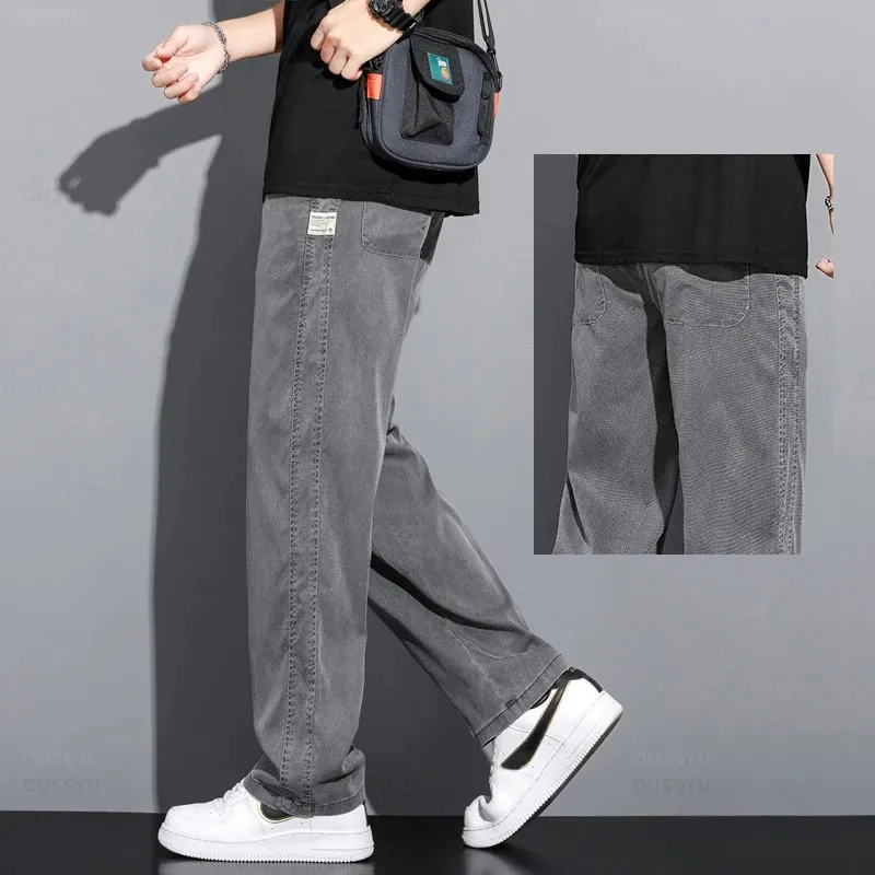 Verão macio lyocell tecido jeans masculino fino solto calças retas cordão elástico na cintura coreia calças casuais plus size M-5XL