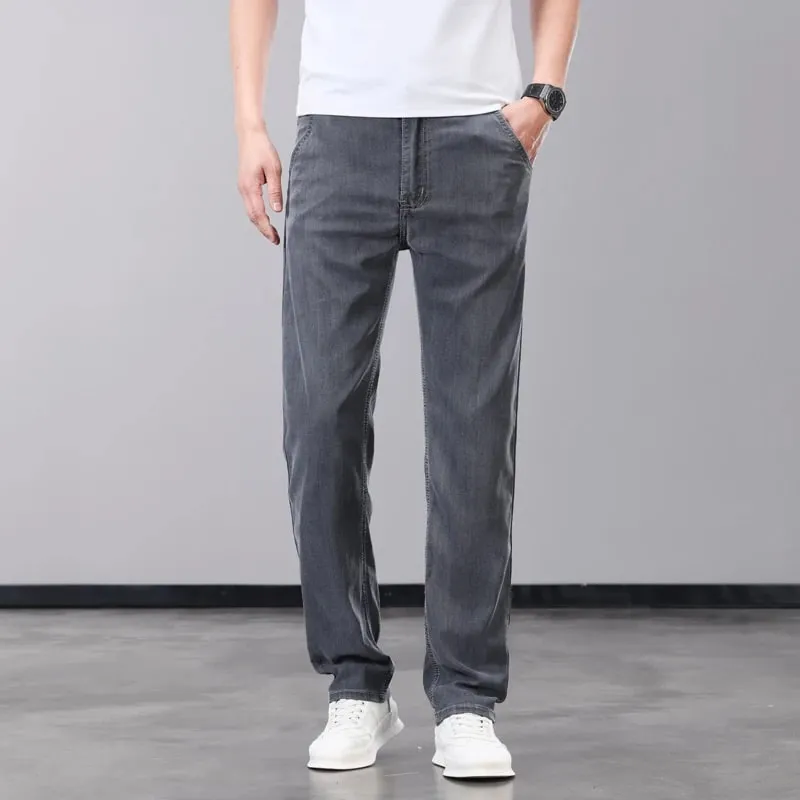 Verão fino jeans masculino lyocell tecido macio respirável calças jeans retas marca homem elástico de seda gelo calças casuais cinza azul
