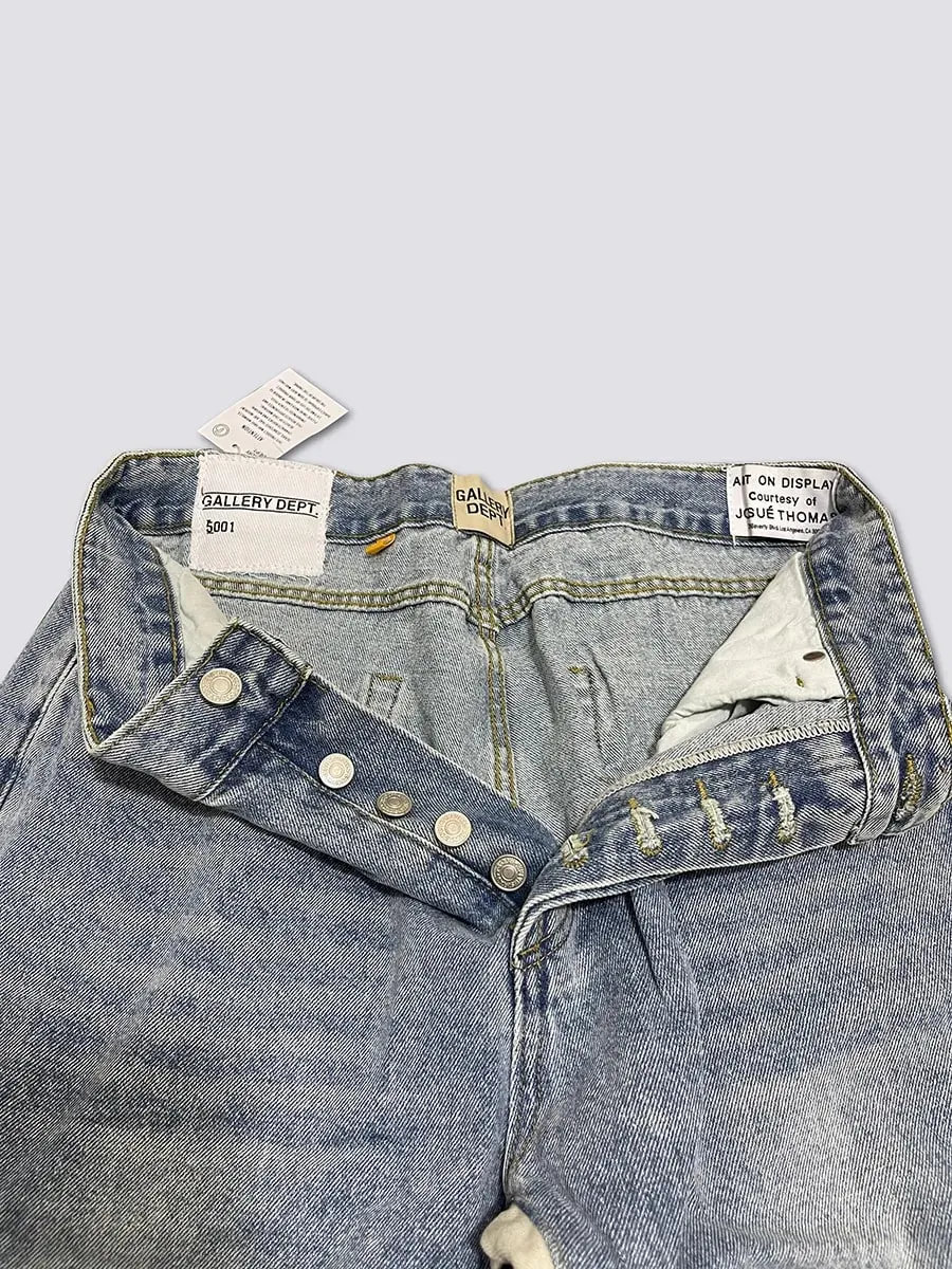 Calça jeans boca de sino lavada e gasta com patchwork
