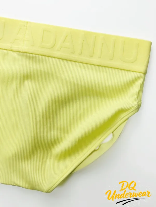 1 Uds. Calzoncillos masculinos acanalados de Color sólido ADANNU Logo en relieve cintura elástica comodidad calzoncillos de Bikini diarios AD759