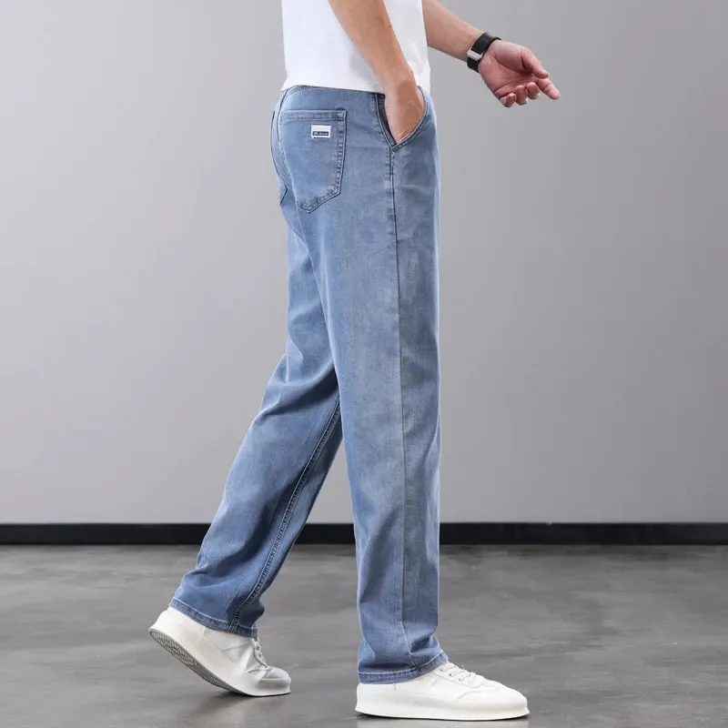 Verão fino jeans masculino lyocell tecido macio respirável calças jeans retas marca homem elástico de seda gelo calças casuais cinza azul