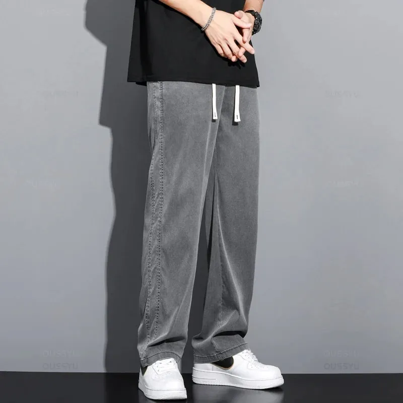Verão macio lyocell tecido jeans masculino fino solto calças retas cordão elástico na cintura coreia calças casuais plus size M-5XL