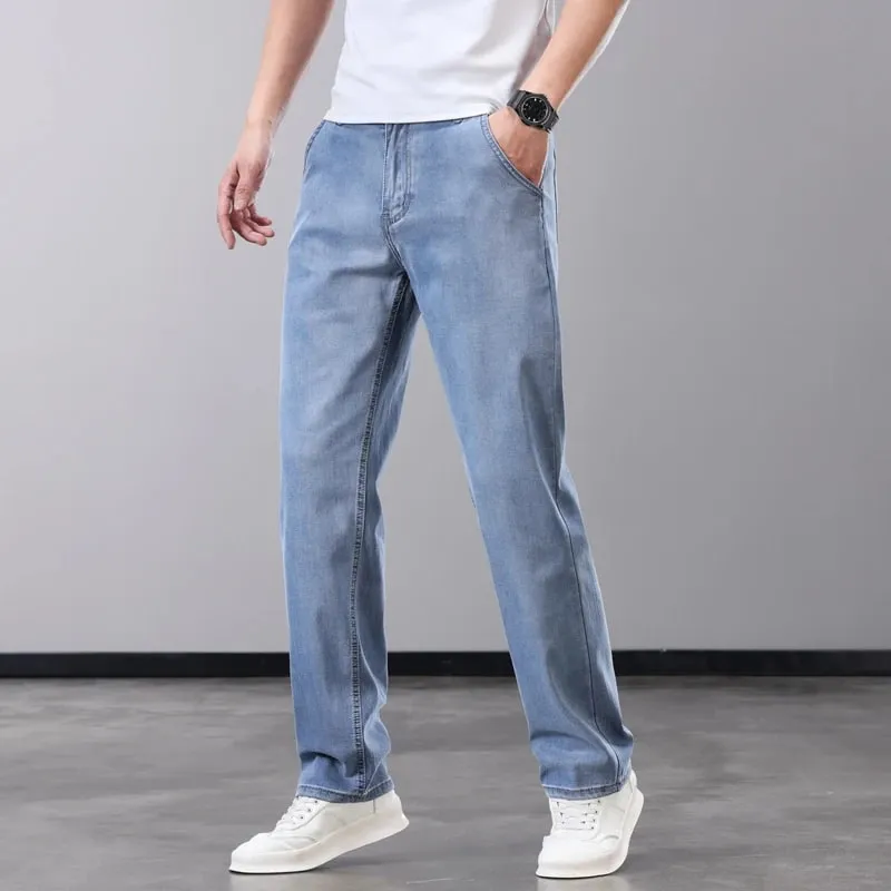 Verão fino jeans masculino lyocell tecido macio respirável calças jeans retas marca homem elástico de seda gelo calças casuais cinza azul