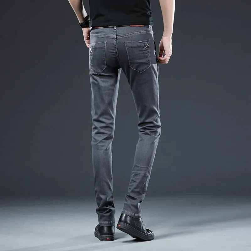Novos homens magro botão preto jeans magros cor sólida estiramento skate multi-botão juventude masculino calças jeans